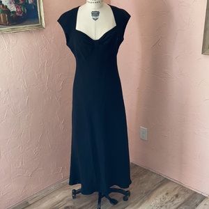Classic black dress, sweetheart neckline.